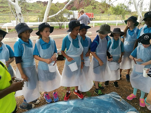Students from Tambery Primary School get ready to paint Water Corporation's pipe for World Water Day