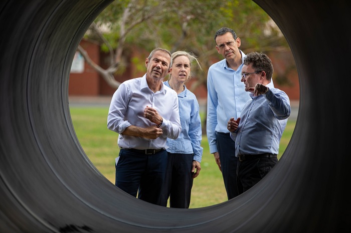 Premier Roger Cook, Water Minister Simone McGurk, Steel Mains CEO Dean Connell and Water Corporation CEO Pat Donovan look inside 1600 steel main pipe