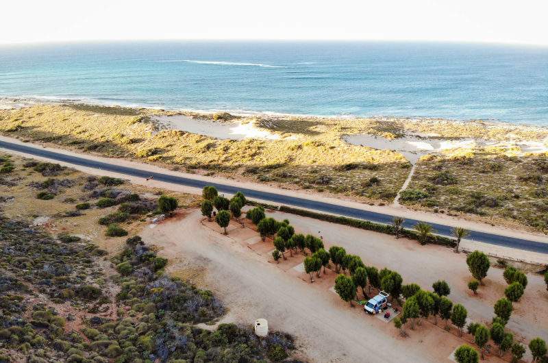 Aerial view of Exmouth coastline, highway and camping ground