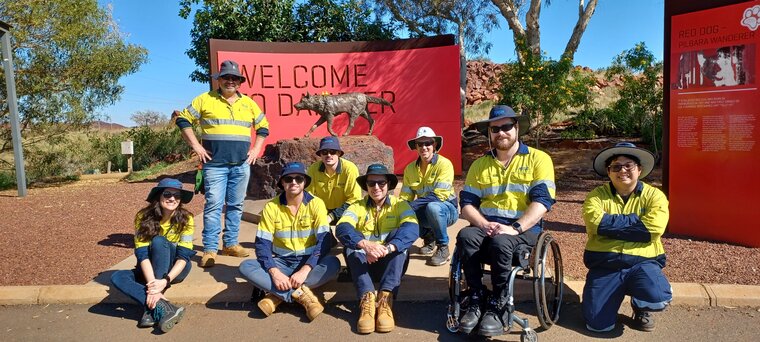 Colleagues from Water Operations getting a picture with Red Dog in Dampier during their trip to Karratha for the annual operating strategy.