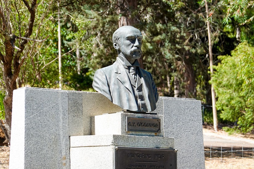 A bust statue of C.Y. O'Connor with an informational plaque at Mundaring Weir