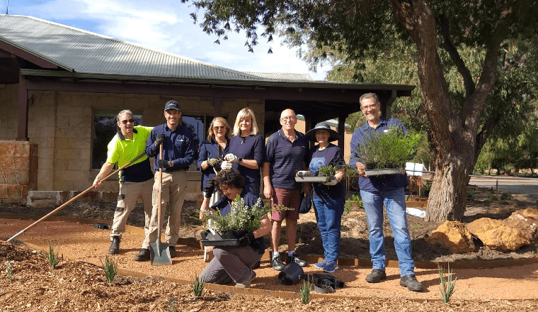 Community volunteers helping to plant the waterwise garden