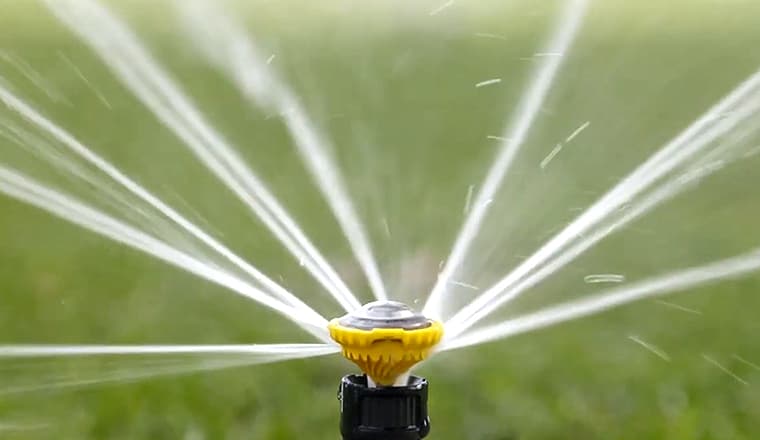 A rotary sprinkler watering lawn