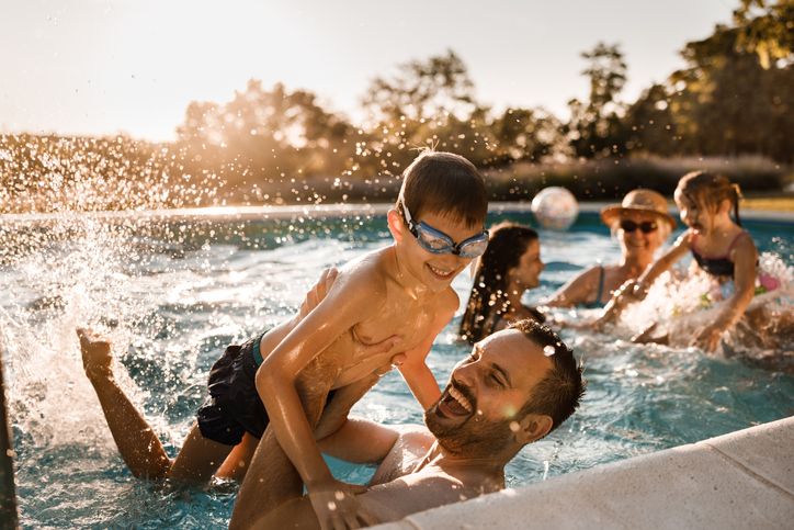 family having fun in the pool