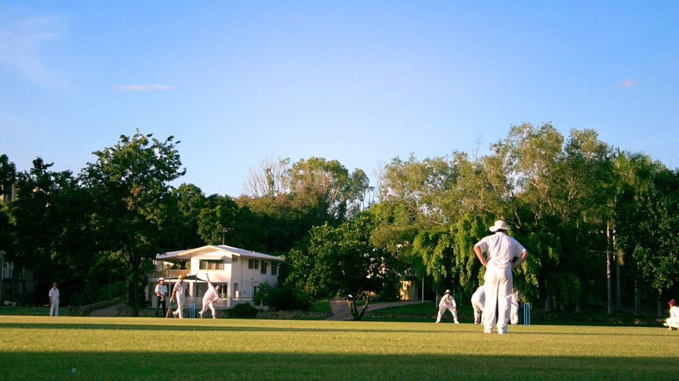 Game of cricket on a sunny day