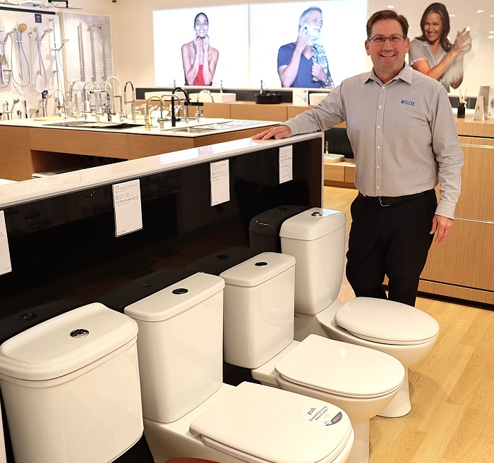 Demand Delivery Manager Damien Postma promoting dual flush toilets