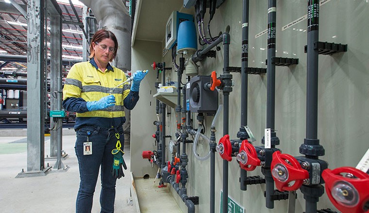 Dr Stacey, an employee at Water Corporation. works while wearing protective equipment
