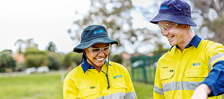 Image of graduates working together