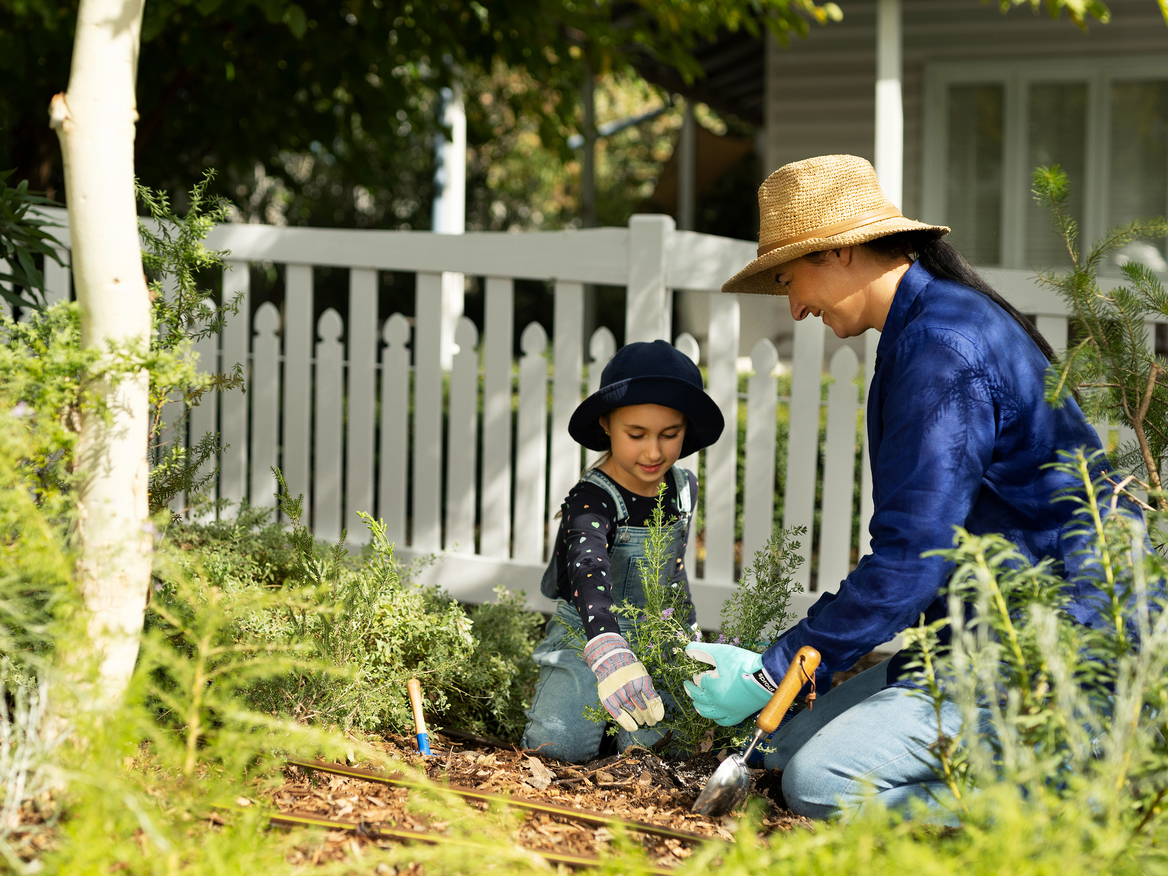 Image of family planting garden