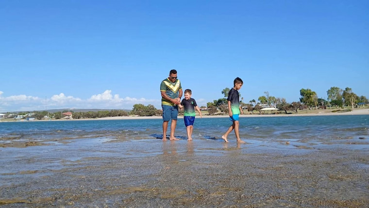 Steven with family at the beach
