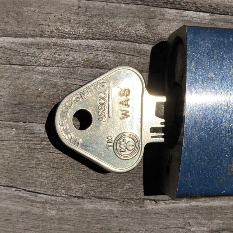 A master key for a Western Australian Services (WAS) lock. The key has 'WAS' engraved on its side.