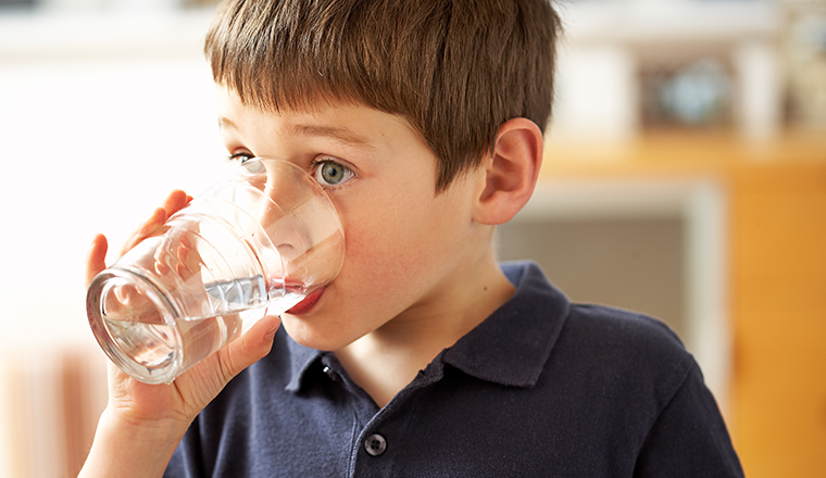 Boy drinking glass of water